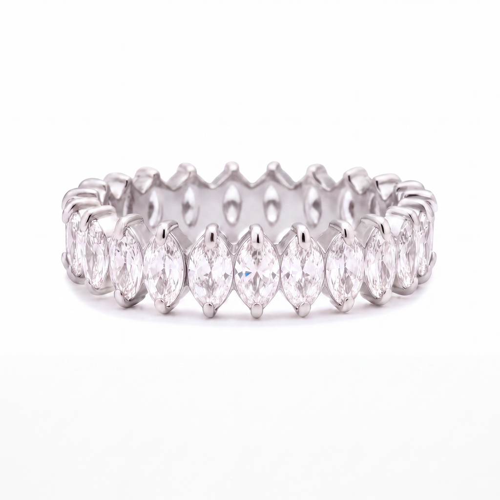 A silver eternity ring featuring a continuous row of marquise-cut clear gemstones in a prong setting, shown against a plain white background.