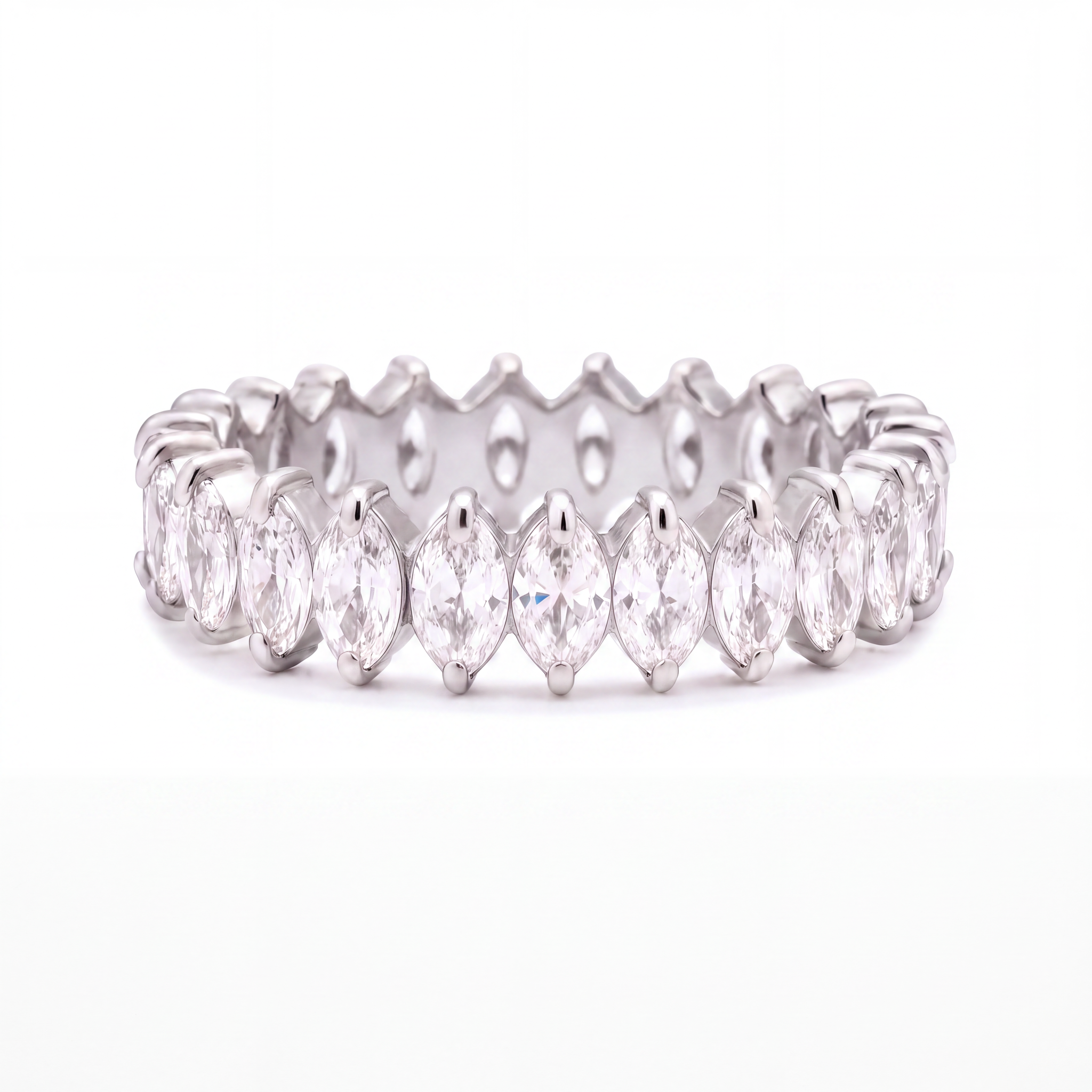 A silver eternity ring featuring a continuous row of marquise-cut clear gemstones in a prong setting, shown against a plain white background.