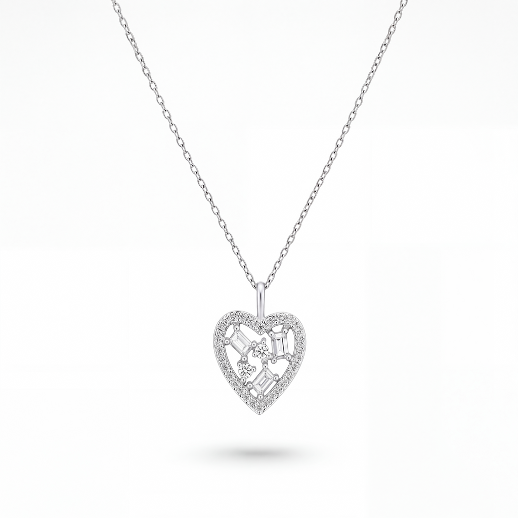 A silver heart-shaped pendant necklace with a delicate chain, featuring a central floral motif and small clear stones, shown on a clean white background.