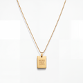 A gold ball-chain necklace with a rectangular gold pendant engraved with the words 'MORE SELF LOVE' in all caps, shown against a clean white background.