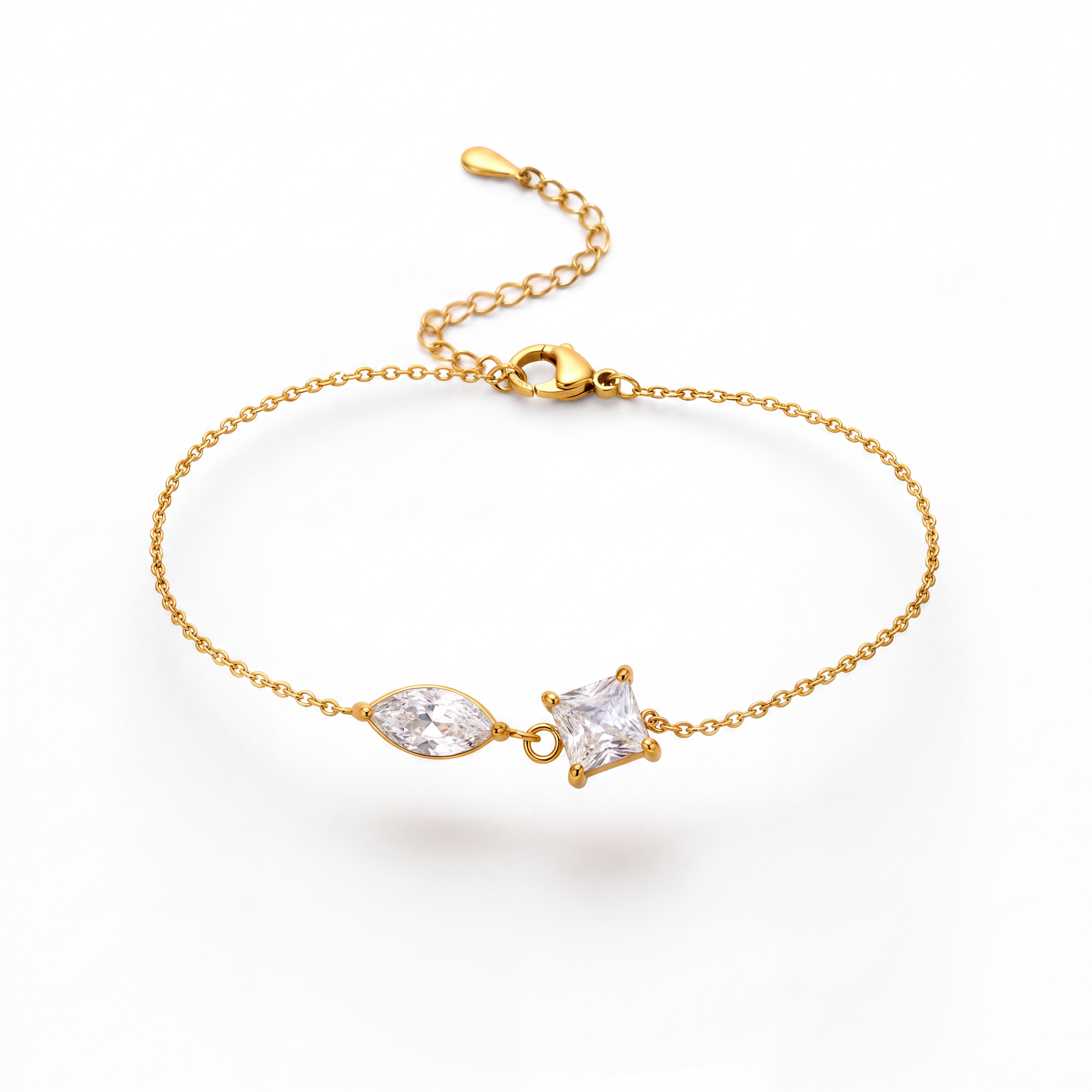 A delicate gold chain bracelet featuring a marquise-cut clear gemstone and a small triangular clear gemstone set in gold, displayed on a clean white background.