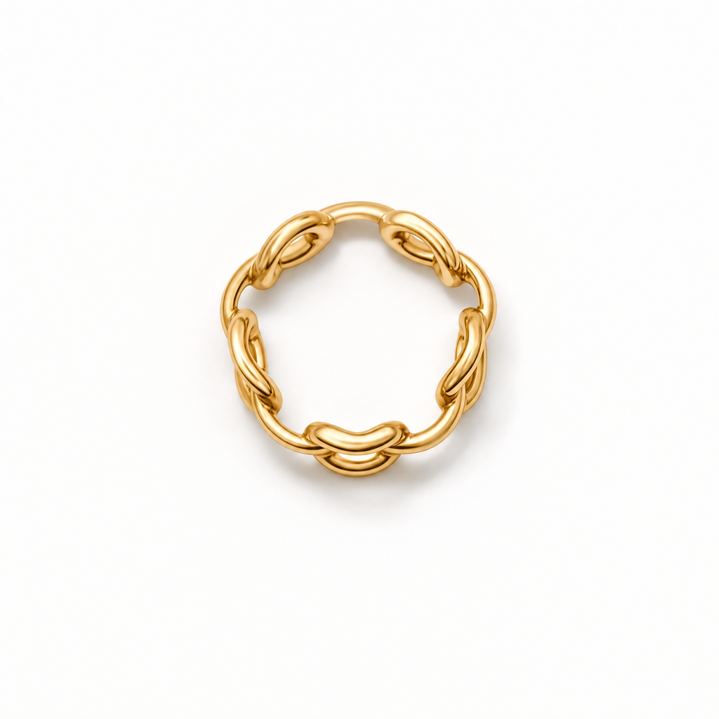 A gold chain-link ring with a circular, interlocking design, photographed on a clean white background.